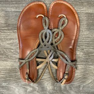 Flat sandals, gold accents